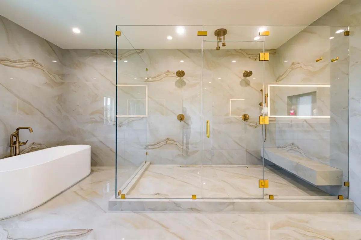 Walk-in shower with large-format tile beside a freestanding soaking tub in a modern Los Angeles bathroom remodel.