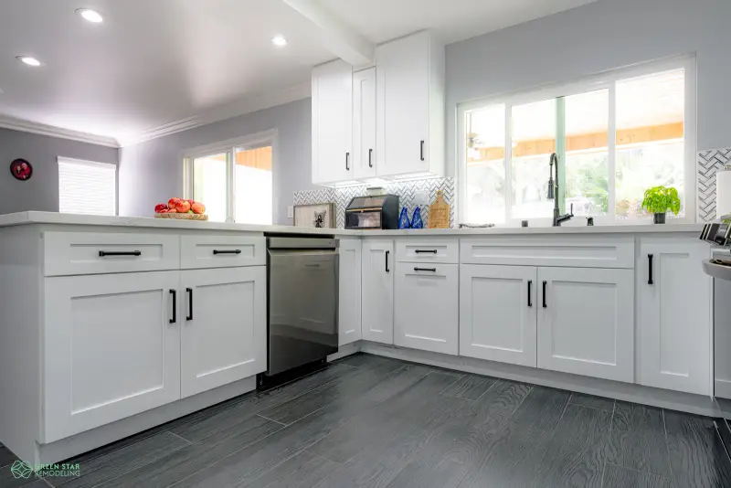 White shaker cabinets and quartz countertops in a Santa Clarita kitchen remodel by Green Star Remodeling.
